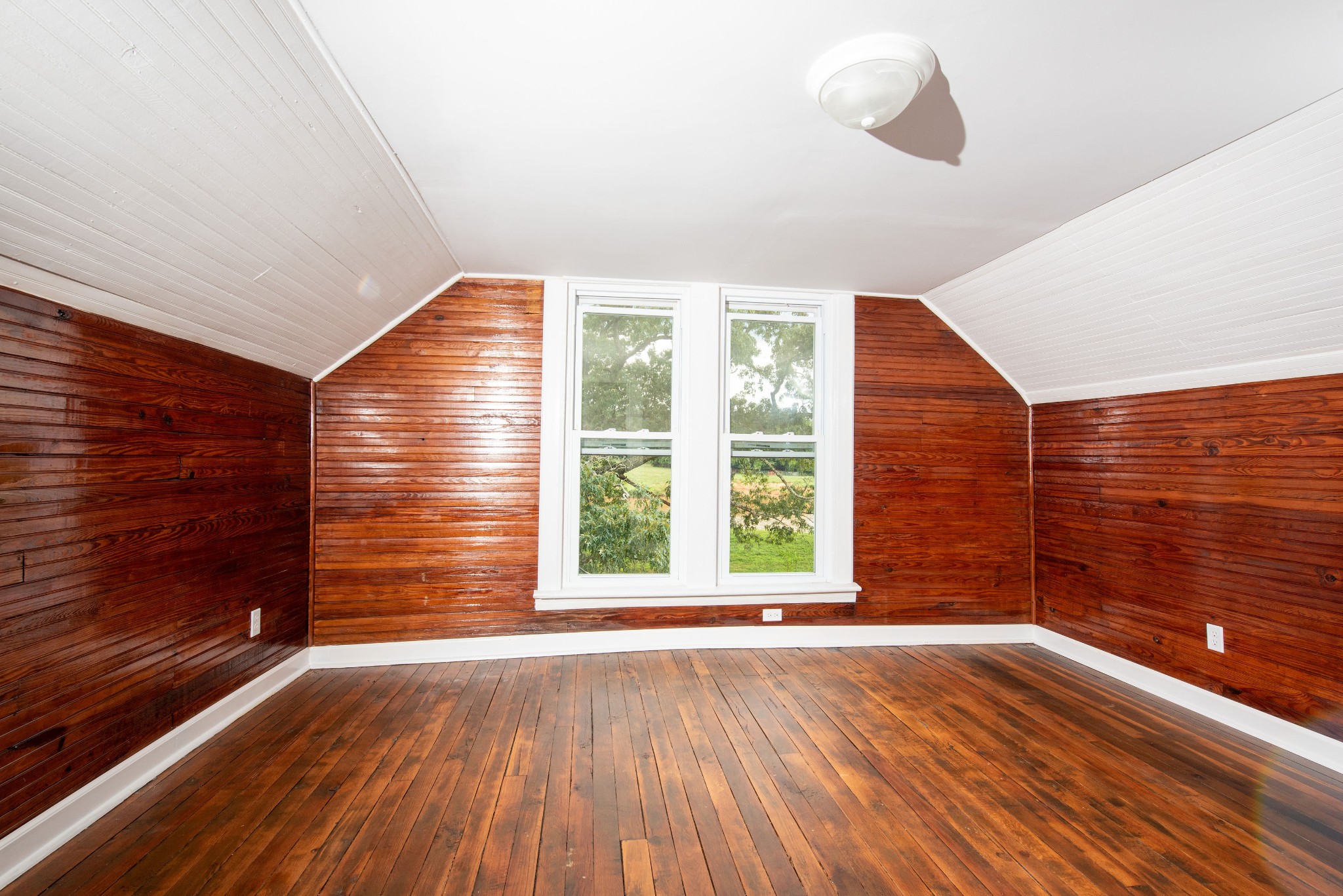 3058 Lipscomb Road Springfield, TN 37172 - Photo 10 of 19 a view of an empty room with wooden floor and a window
