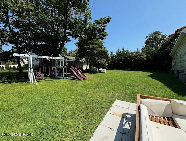 184 Ridgewood Avenue Oakhurst, NJ 07755 - Photo 16 of 16 a view of a garden with a slide
