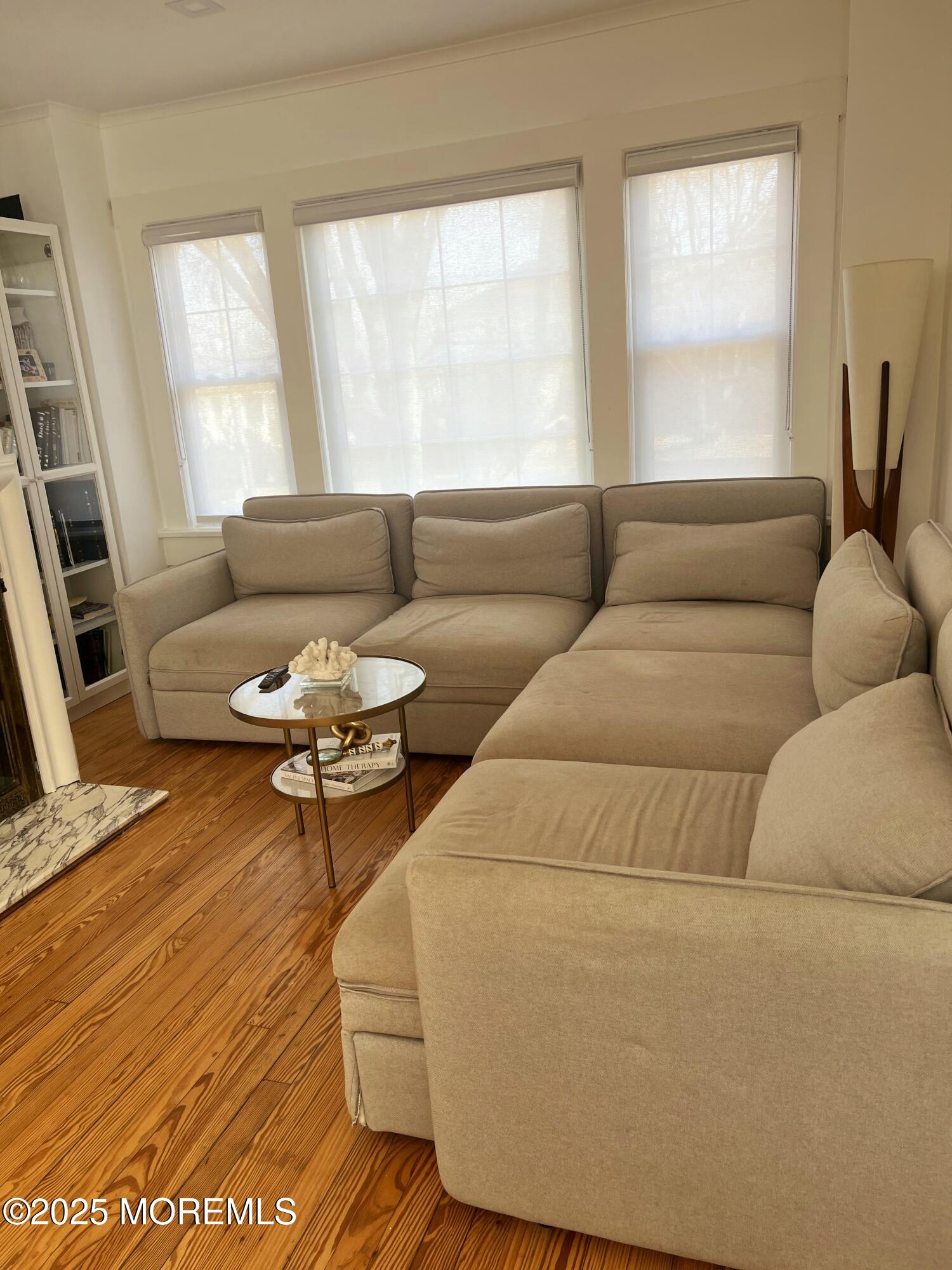184 Ridgewood Avenue Oakhurst, NJ 07755 - Photo 2 of 16 a living room with furniture and a large window