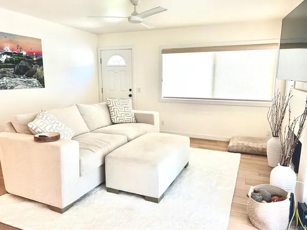 a living room with furniture and a large window