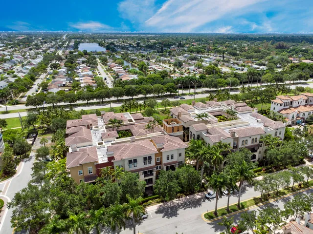 an aerial view of residential houses with outdoor space