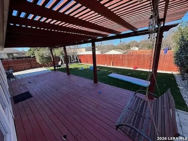 a view of porch with wooden floor