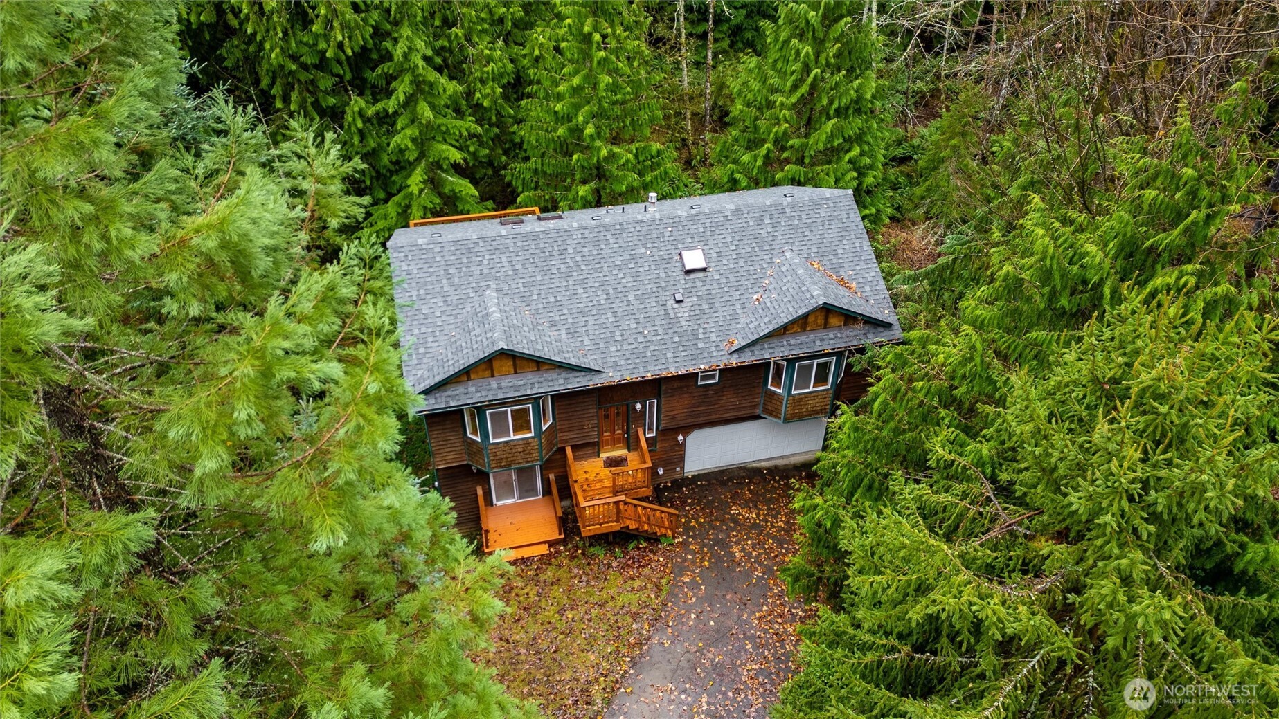 36 Holly View Way Bellingham, WA 98229 - Photo 2 of 40 an aerial view of a house with swimming pool and large trees