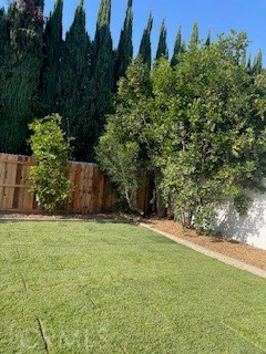 19284 Krameria Avenue Riverside, CA 92508 - Photo 16 of 26 a backyard of a house with lots of green space and fountain