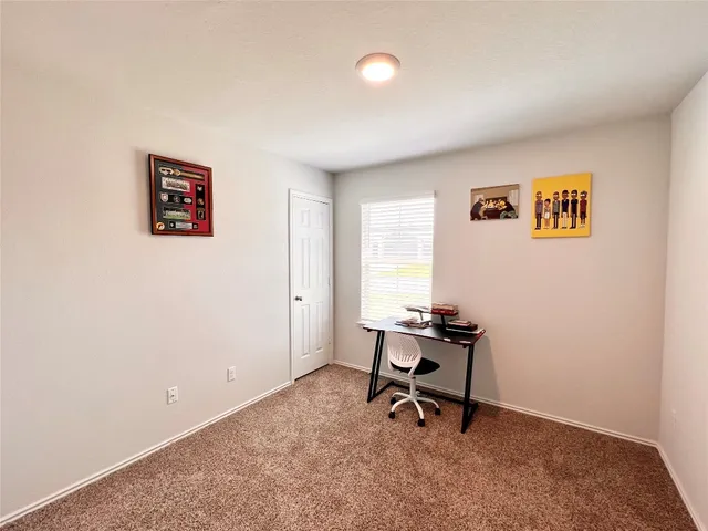 a kitchen island with granite countertop a table and chairs