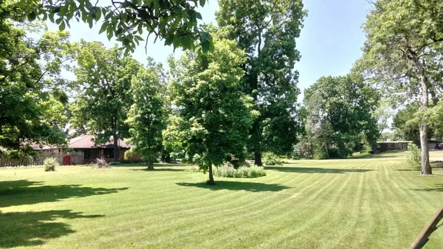 a view of swimming pool with a bench
