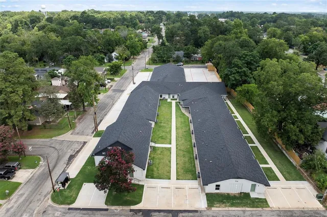 an aerial view of residential houses with outdoor space