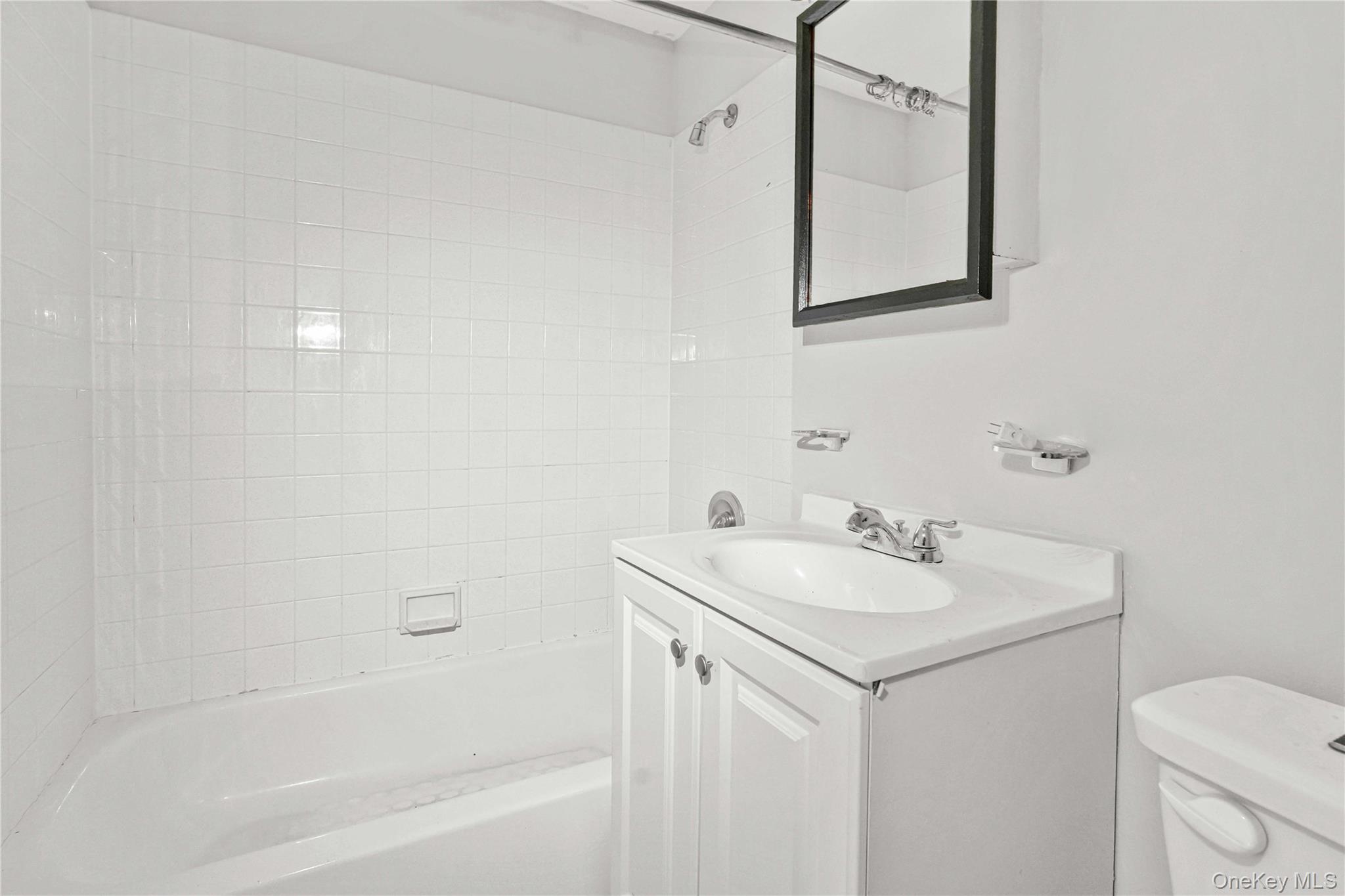 758 Brook Avenue, Unit 56C Bronx, NY 10455 - Photo 8 of 16 Full bathroom with shower combination and vanity