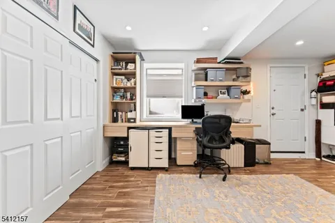 a view of a workspace with furniture