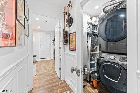 a view of a storage and utility room with a washer dryer