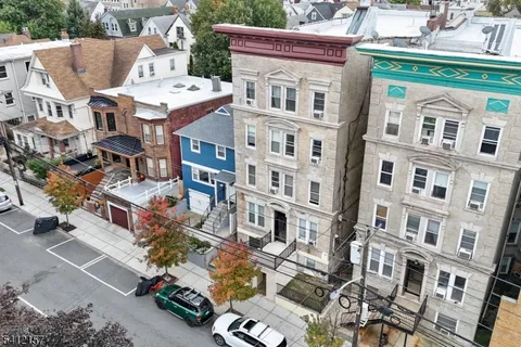 a view of a building with a lot of residential buildings