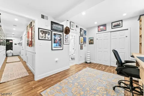 a view of a workspace with furniture and gym equipment
