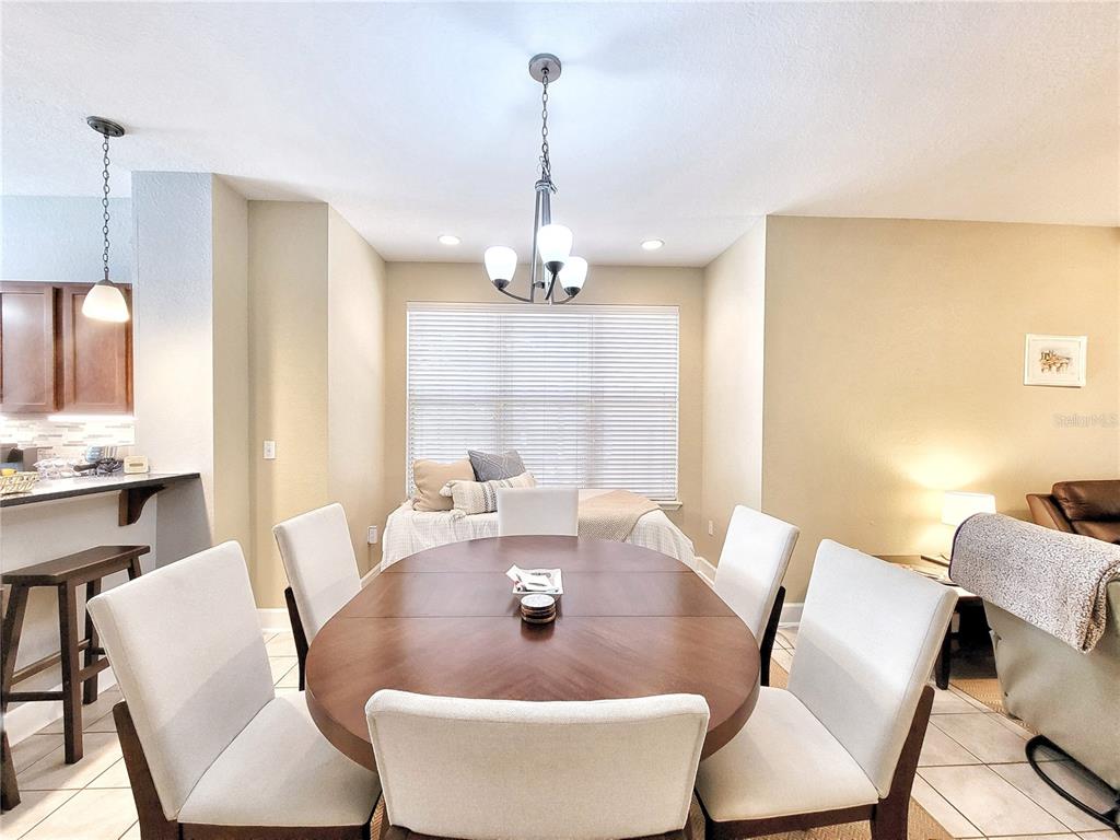 2508 Southwest 35th Place, Unit P91 Gainesville, FL 32608 - Photo 11 of 33 a view of a dining room with furniture window and outside view