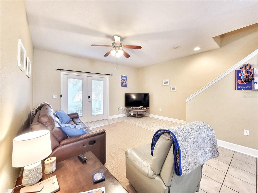 2508 Southwest 35th Place, Unit P91 Gainesville, FL 32608 - Photo 12 of 33 a living room with furniture and a flat screen tv