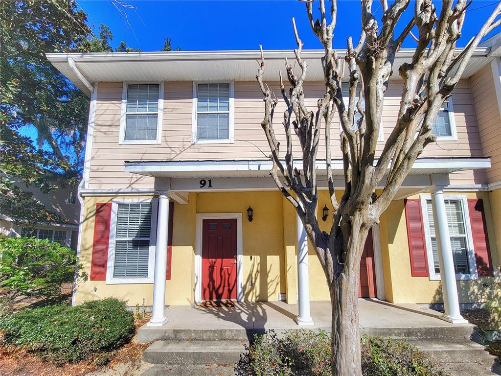 2508 Southwest 35th Place, Unit P91 Gainesville, FL 32608 - Photo 2 of 33 a front view of a house with a tree