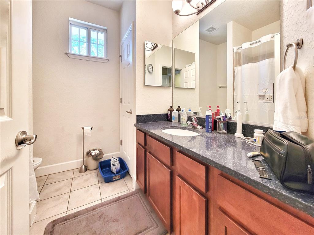 2508 Southwest 35th Place, Unit P91 Gainesville, FL 32608 - Photo 25 of 33 a bathroom with a sink double vanity and a mirror