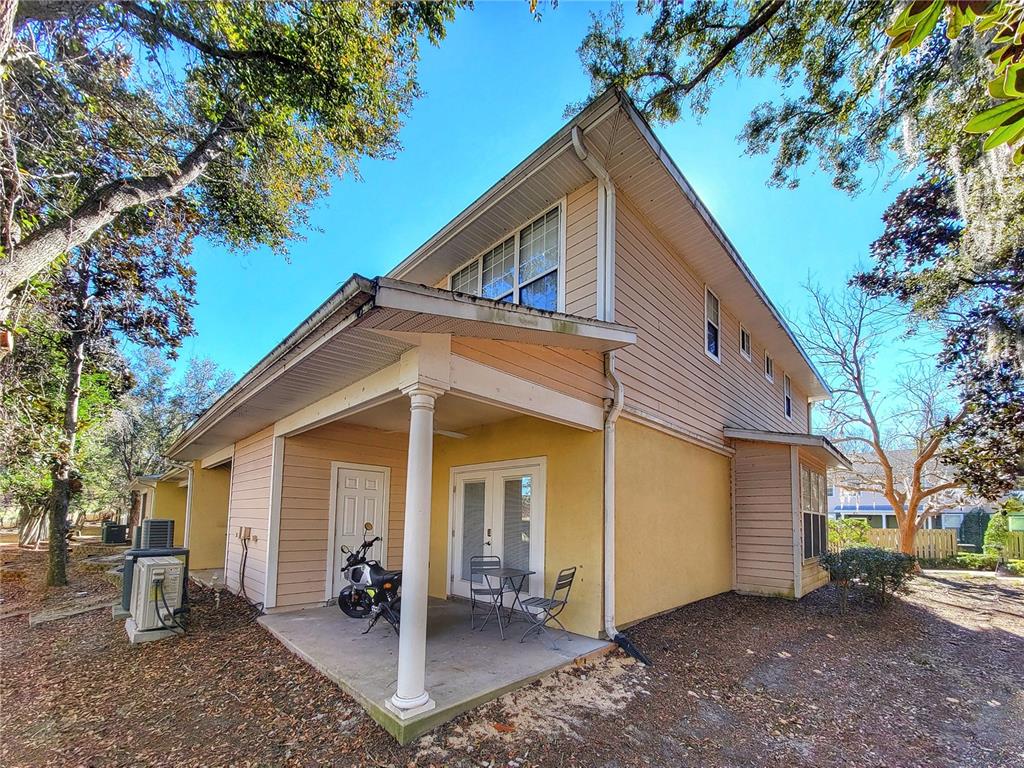 2508 Southwest 35th Place, Unit P91 Gainesville, FL 32608 - Photo 28 of 33 a view of a house with a yard
