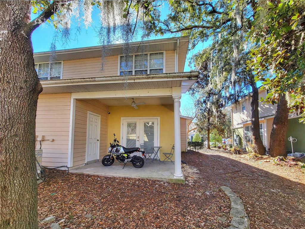 2508 Southwest 35th Place, Unit P91 Gainesville, FL 32608 - Photo 29 of 33 a view of a house with a patio