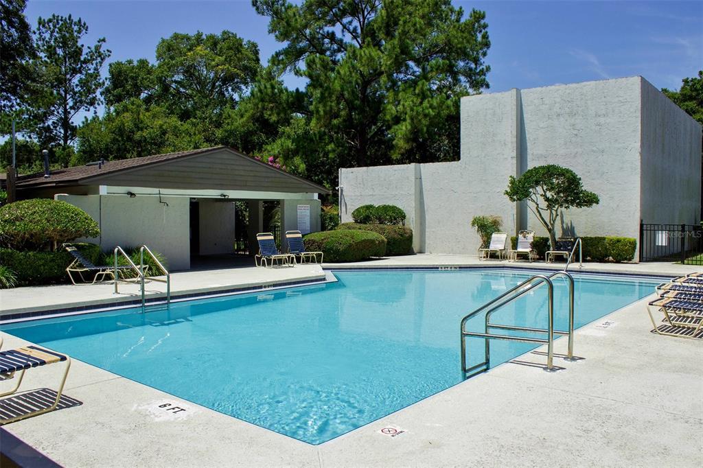 2508 Southwest 35th Place, Unit P91 Gainesville, FL 32608 - Photo 31 of 33 a swimming pool with outdoor seating and yard