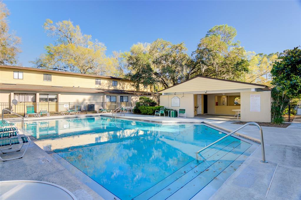 2508 Southwest 35th Place, Unit P91 Gainesville, FL 32608 - Photo 32 of 33 a view of a house with pool and a yard