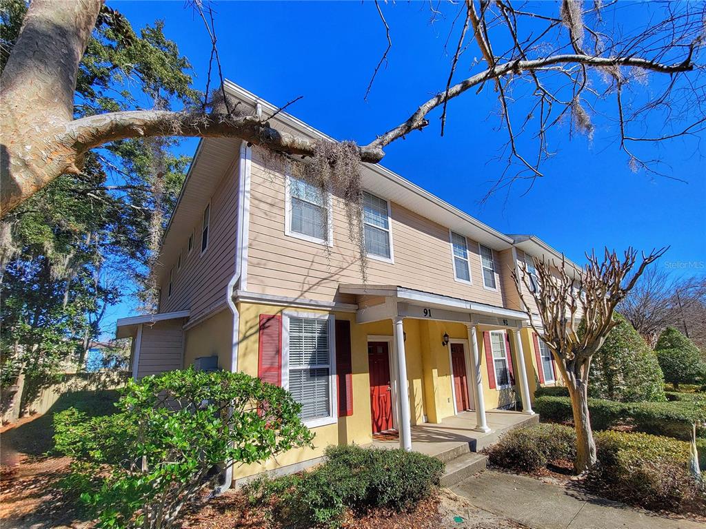 2508 Southwest 35th Place, Unit P91 Gainesville, FL 32608 - Photo 4 of 33 a view of a white building with large windows