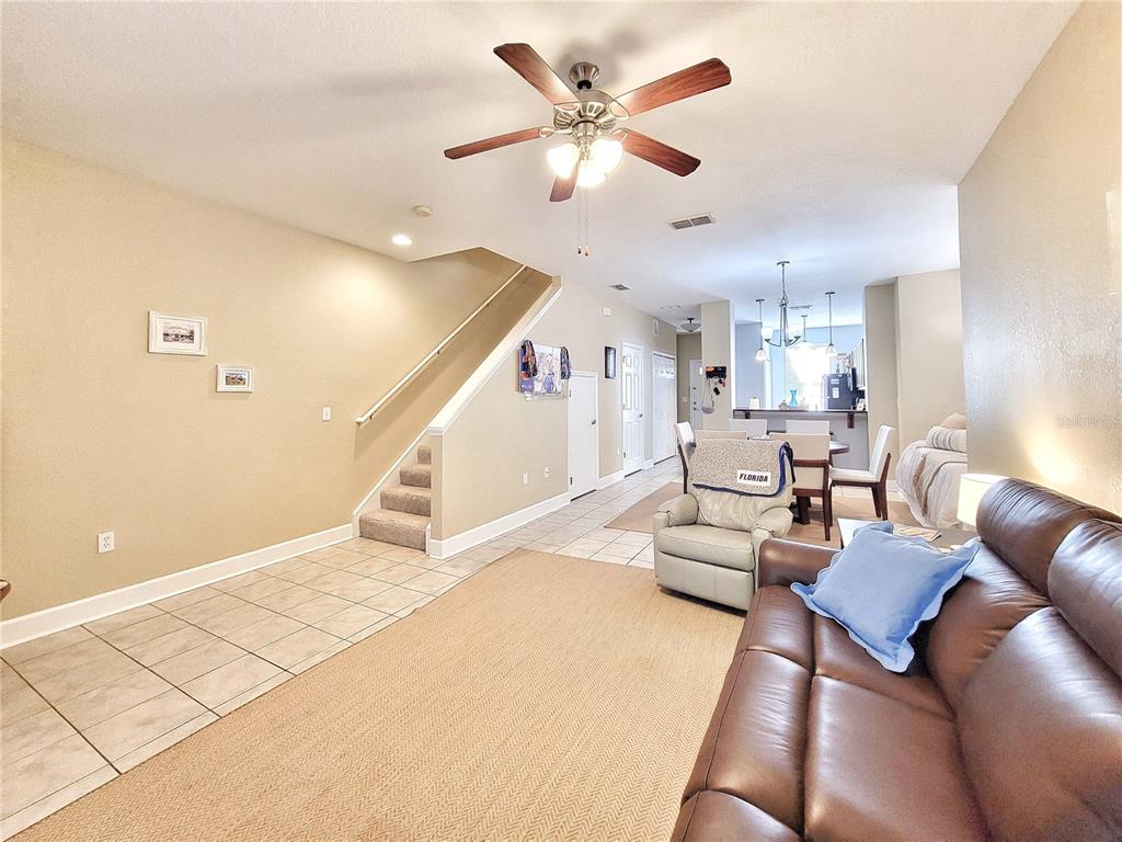 2508 Southwest 35th Place, Unit P91 Gainesville, FL 32608 - Photo 6 of 33 a living room with furniture and a ceiling fan
