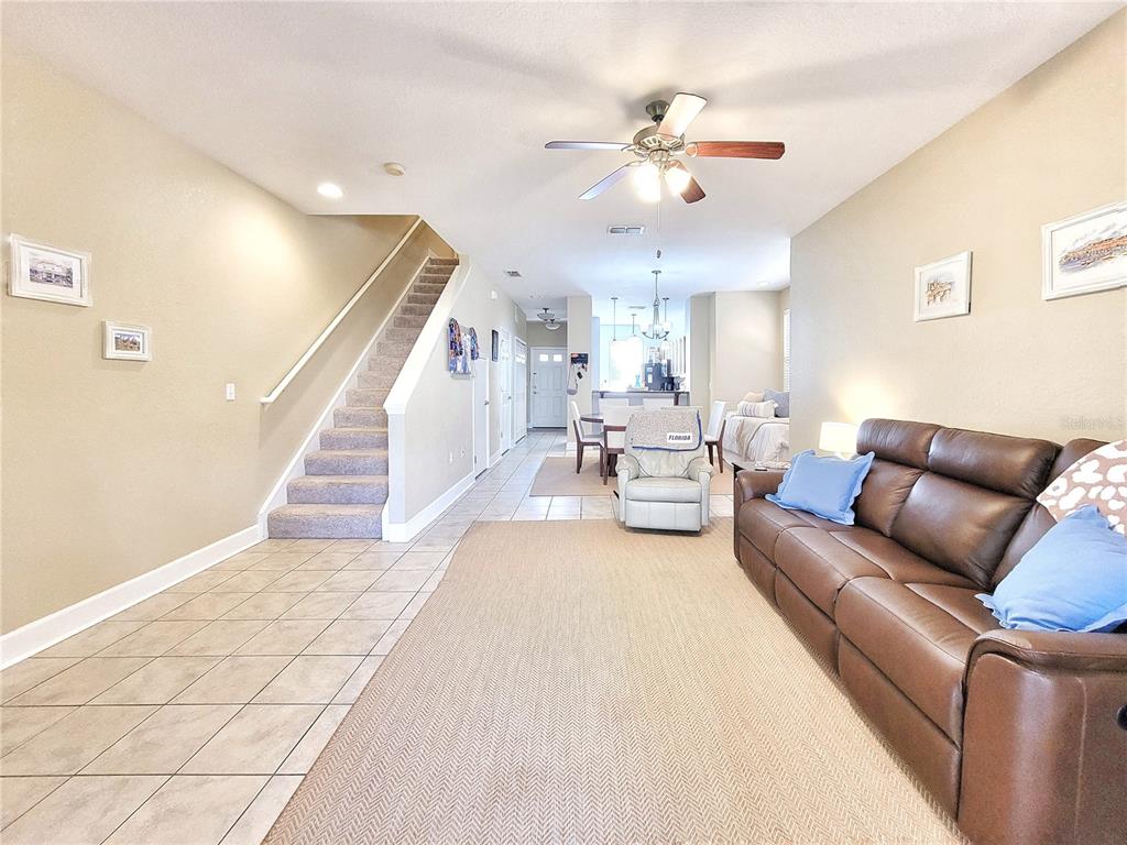 2508 Southwest 35th Place, Unit P91 Gainesville, FL 32608 - Photo 8 of 33 a living room with furniture and chandelier