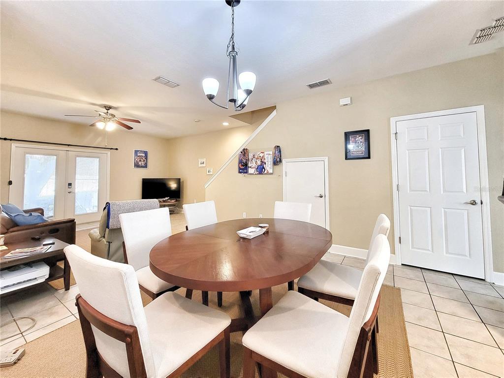 2508 Southwest 35th Place, Unit P91 Gainesville, FL 32608 - Photo 10 of 33 a view of a dining room with furniture and wooden floor