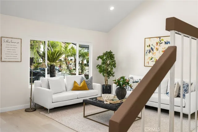 a kitchen with kitchen island granite countertop a sink a counter top space stainless steel appliances and cabinets