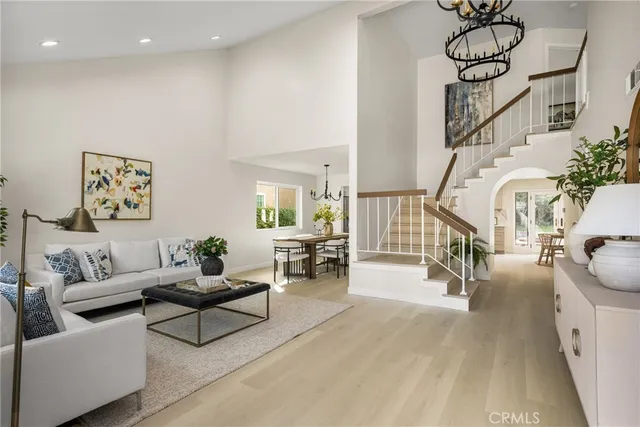 a dining room with furniture and wooden floor