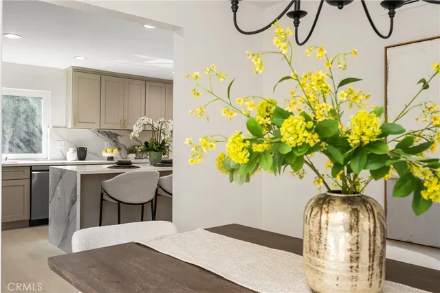 a kitchen with a table and chairs