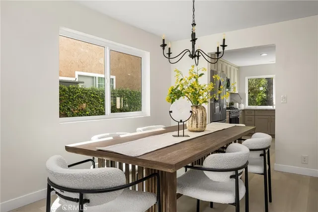 a living room with furniture and a painting on the wall
