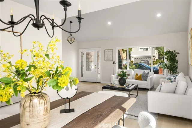 a living room with furniture potted plant and a fireplace