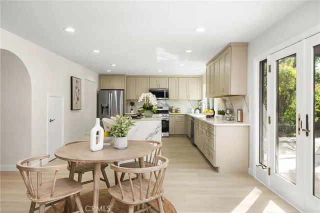 a kitchen with a sink and a potted plant