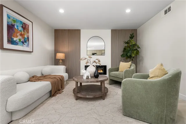 a view of a house with garden and a trees