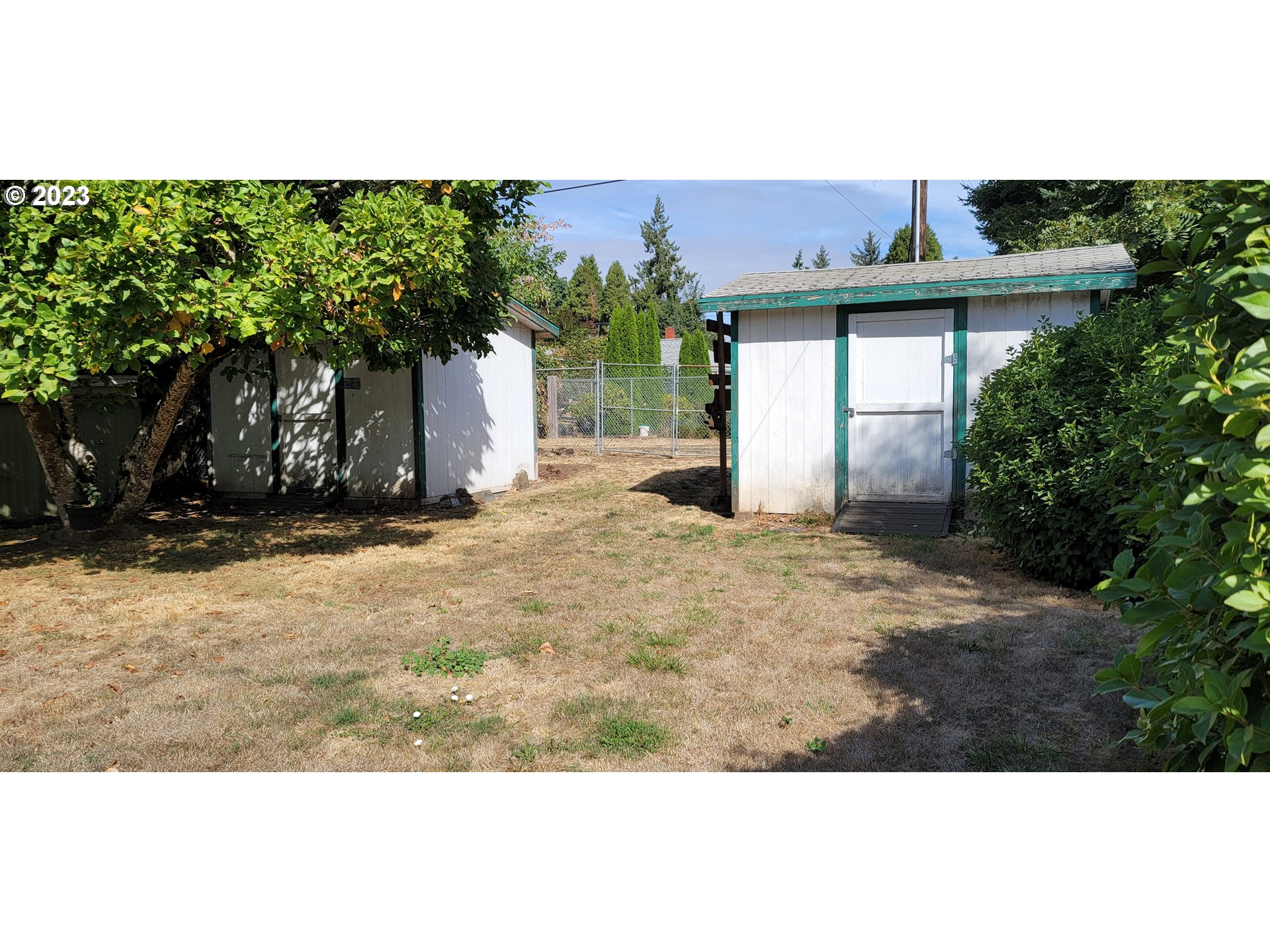 1106 J Street Springfield, OR 97477 - Photo 15 of 17 a view of a white house with a outdoor space