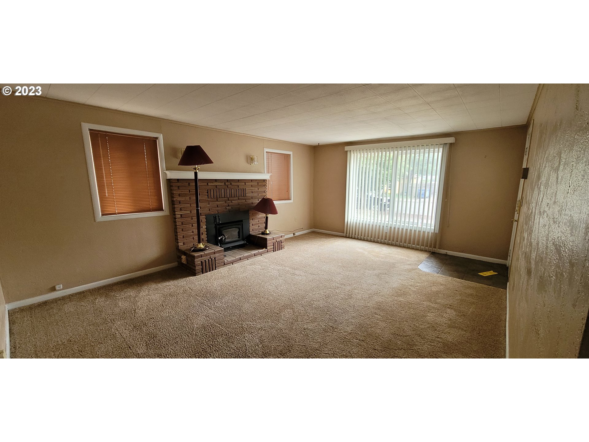 1106 J Street Springfield, OR 97477 - Photo 3 of 17 a living room with furniture and a fireplace