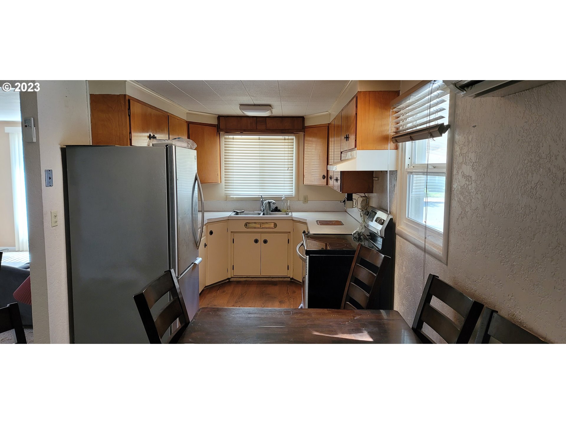 1106 J Street Springfield, OR 97477 - Photo 5 of 17 a kitchen view with appliances a sink cabinets and a window