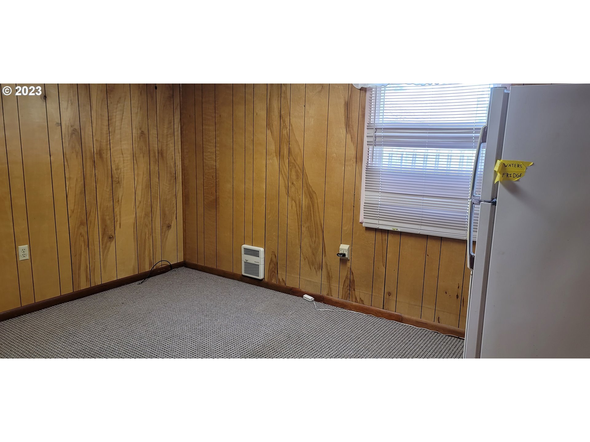 1106 J Street Springfield, OR 97477 - Photo 9 of 17 a view of an empty room and wooden floor