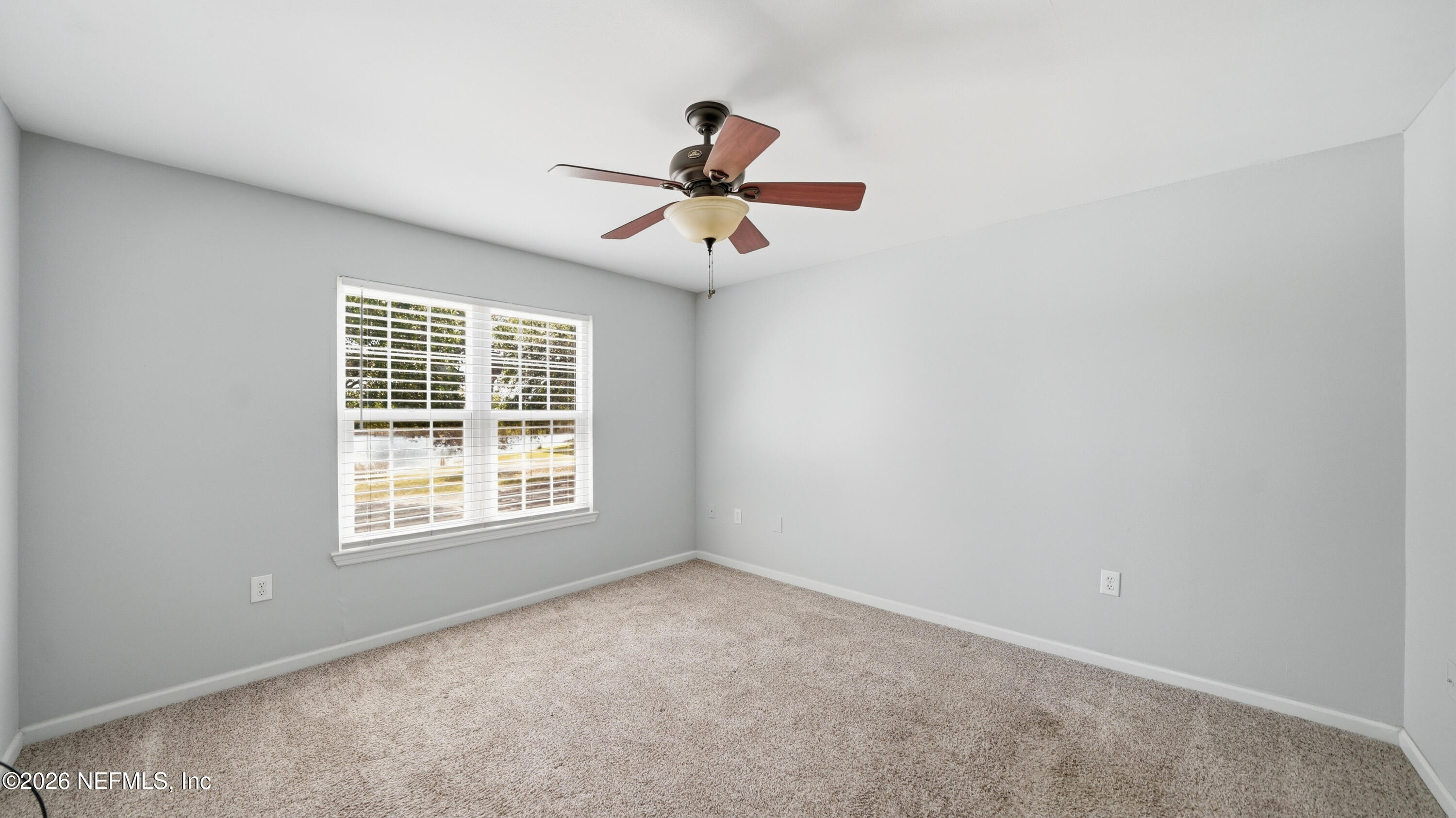 23699 Bahama Point, Unit 1126 Fernandina Beach, FL 32034 - Photo 20 of 50 an empty room with a window and a fan