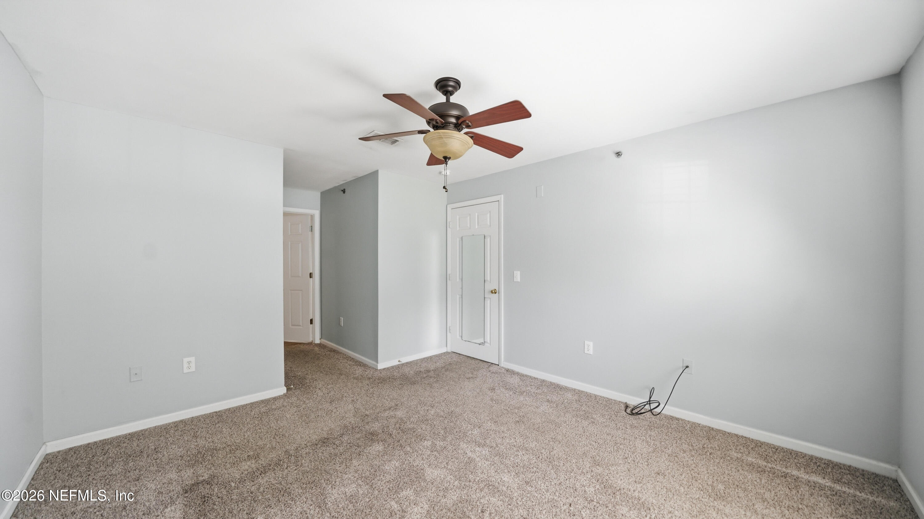 23699 Bahama Point, Unit 1126 Fernandina Beach, FL 32034 - Photo 21 of 50 a view of a big room with carpet
