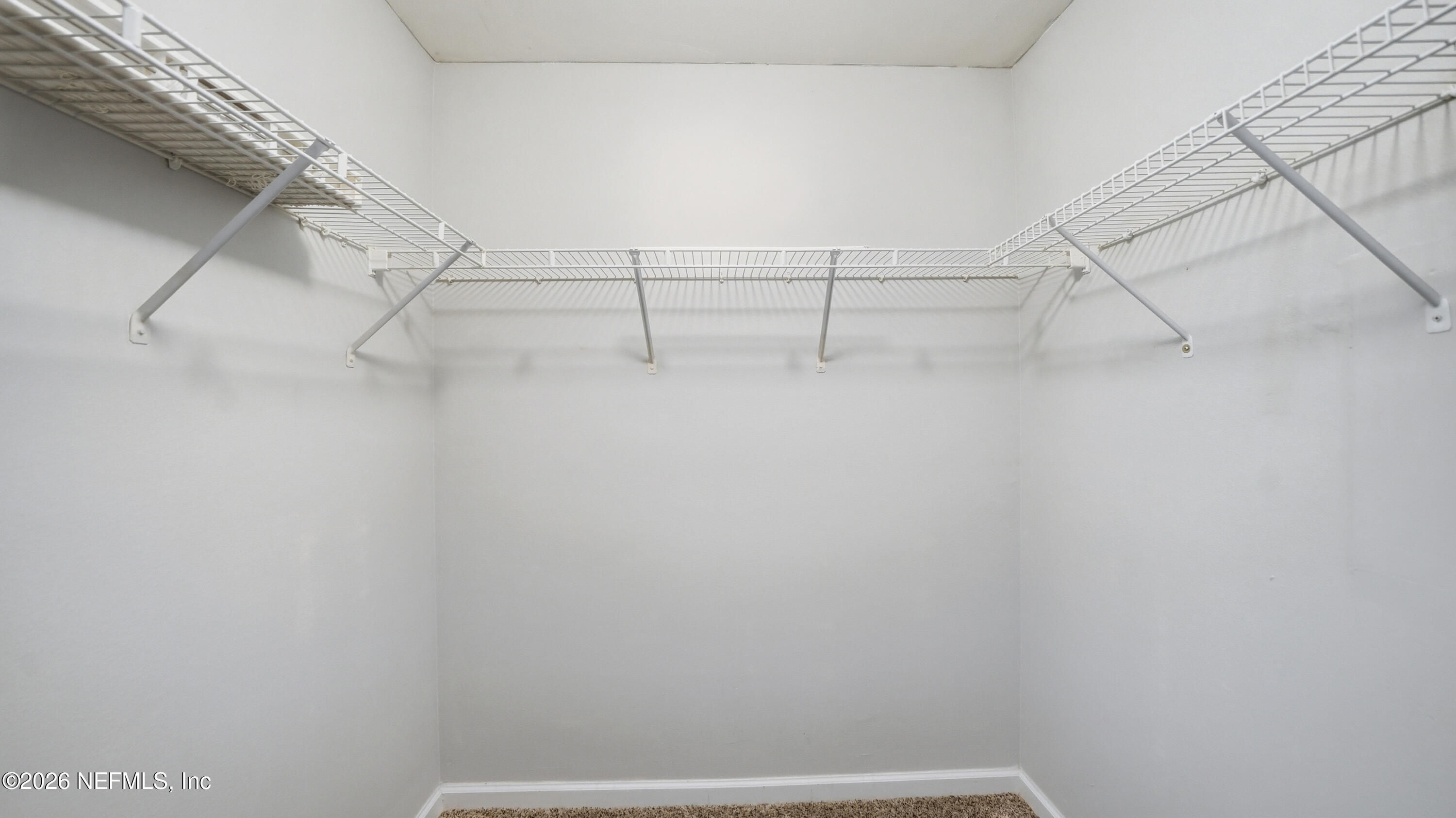 23699 Bahama Point, Unit 1126 Fernandina Beach, FL 32034 - Photo 23 of 50 a view of a room with racks on the wall