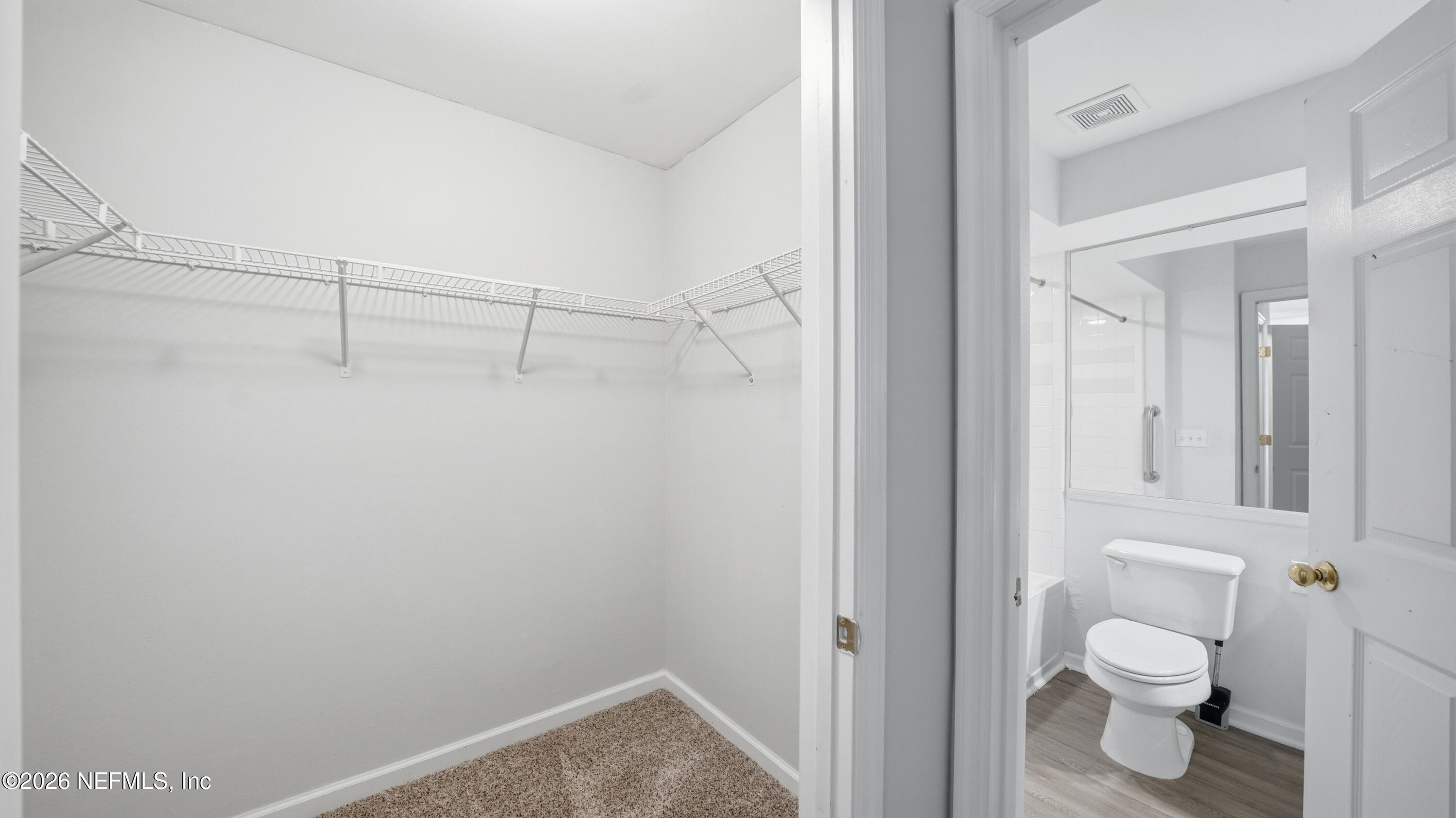 23699 Bahama Point, Unit 1126 Fernandina Beach, FL 32034 - Photo 24 of 50 a bathroom with a toilet and a shower