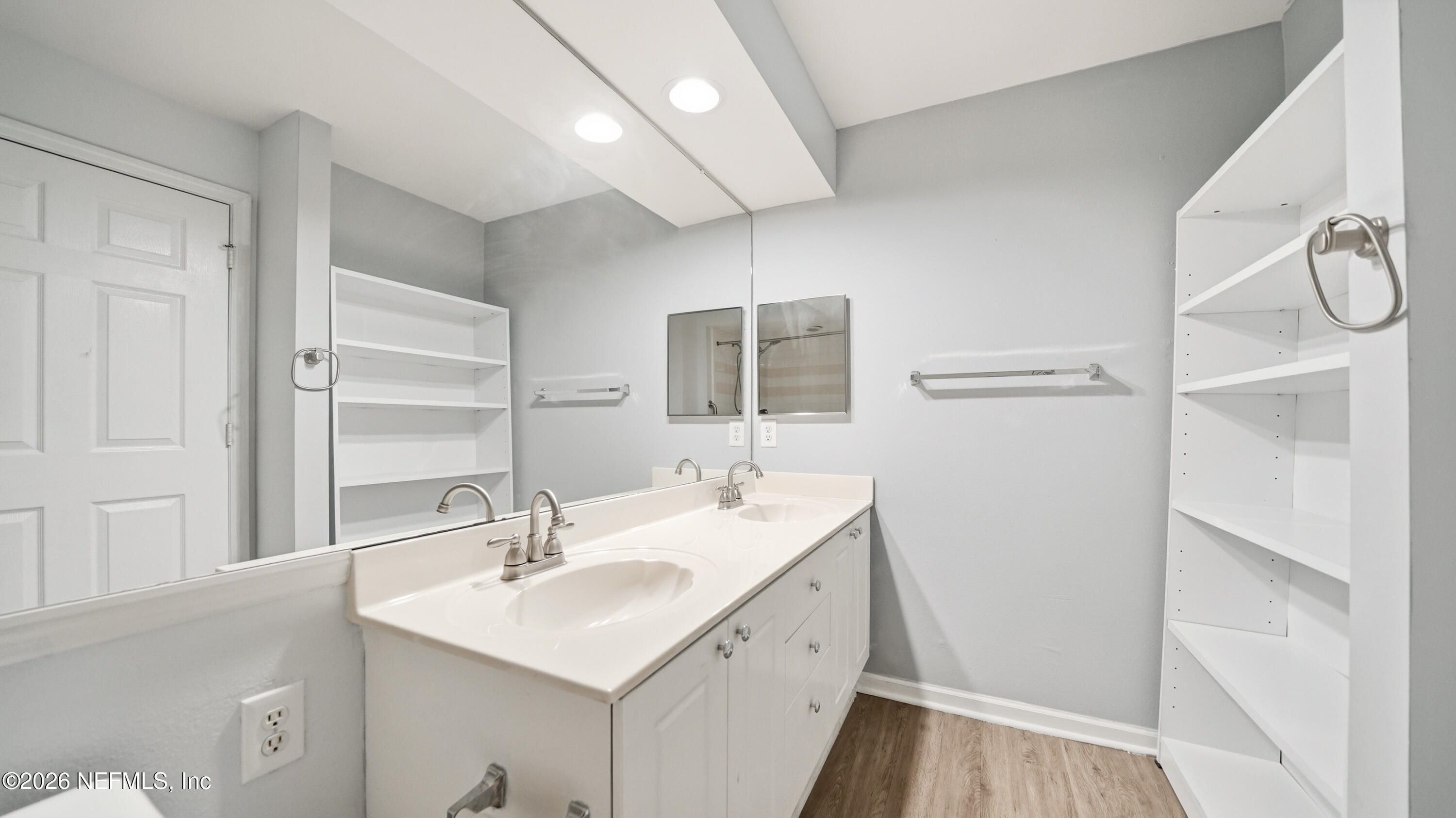 23699 Bahama Point, Unit 1126 Fernandina Beach, FL 32034 - Photo 25 of 50 a bathroom with a sink a toilet a mirror and shower