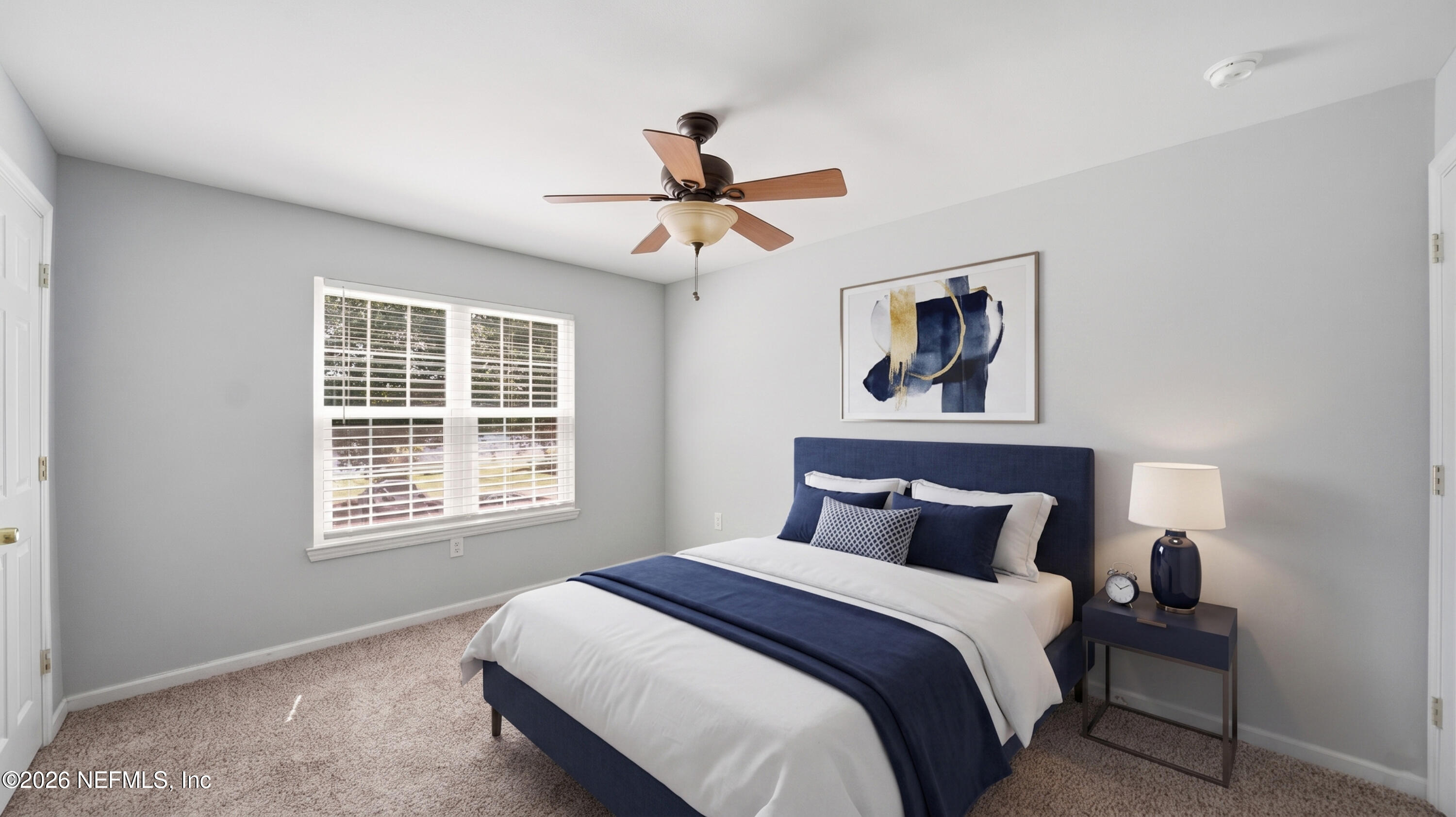 23699 Bahama Point, Unit 1126 Fernandina Beach, FL 32034 - Photo 27 of 50 a bedroom with a bed and a window