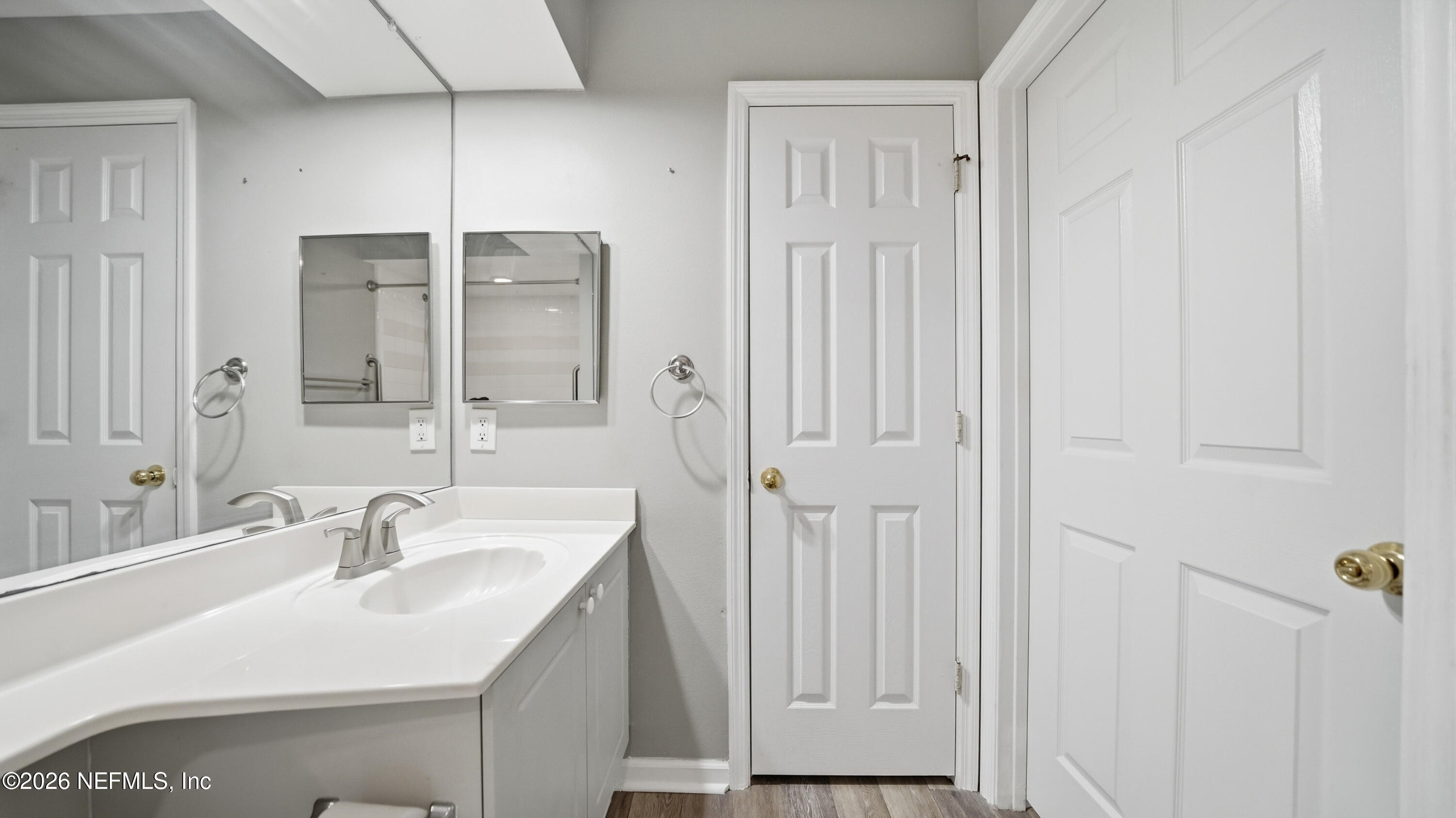 23699 Bahama Point, Unit 1126 Fernandina Beach, FL 32034 - Photo 33 of 50 a bathroom with a sink and a mirror