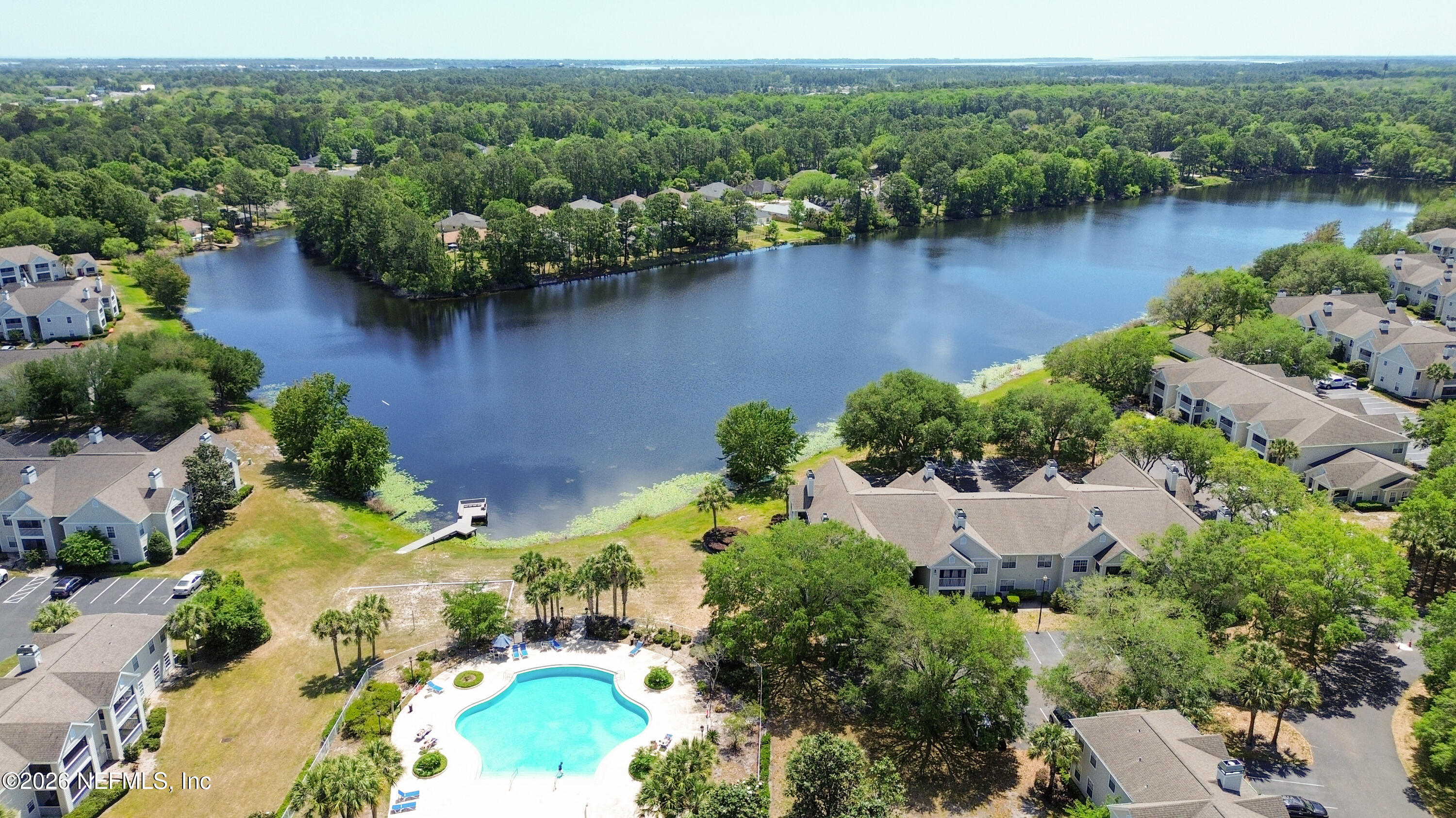 23699 Bahama Point, Unit 1126 Fernandina Beach, FL 32034 - Photo 42 of 50 an aerial view of a house with a yard and lake view