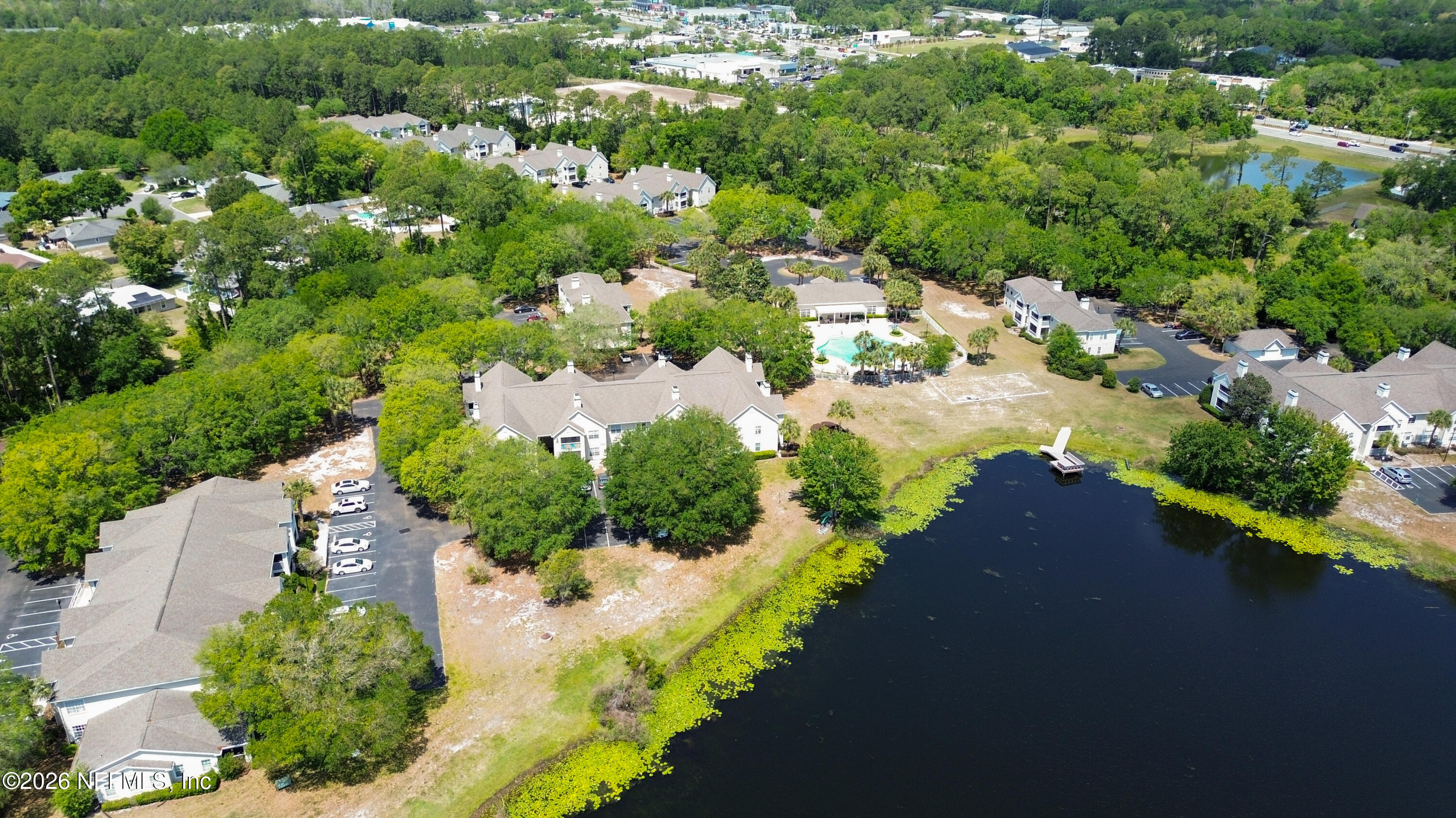 23699 Bahama Point, Unit 1126 Fernandina Beach, FL 32034 - Photo 44 of 50 an aerial view of a house with a yard and lake view