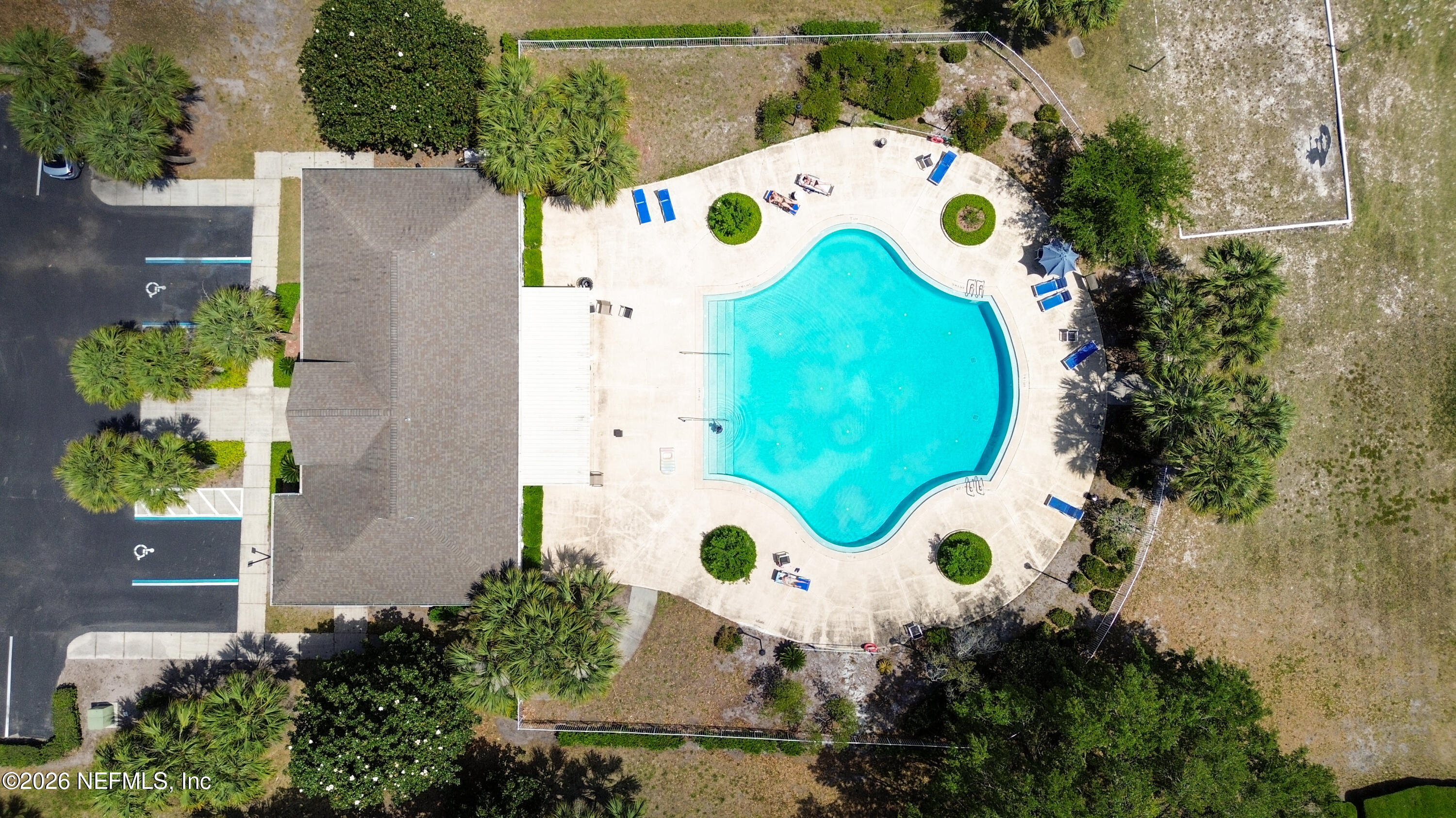 23699 Bahama Point, Unit 1126 Fernandina Beach, FL 32034 - Photo 46 of 50 an aerial view of a house with a pool and a yard