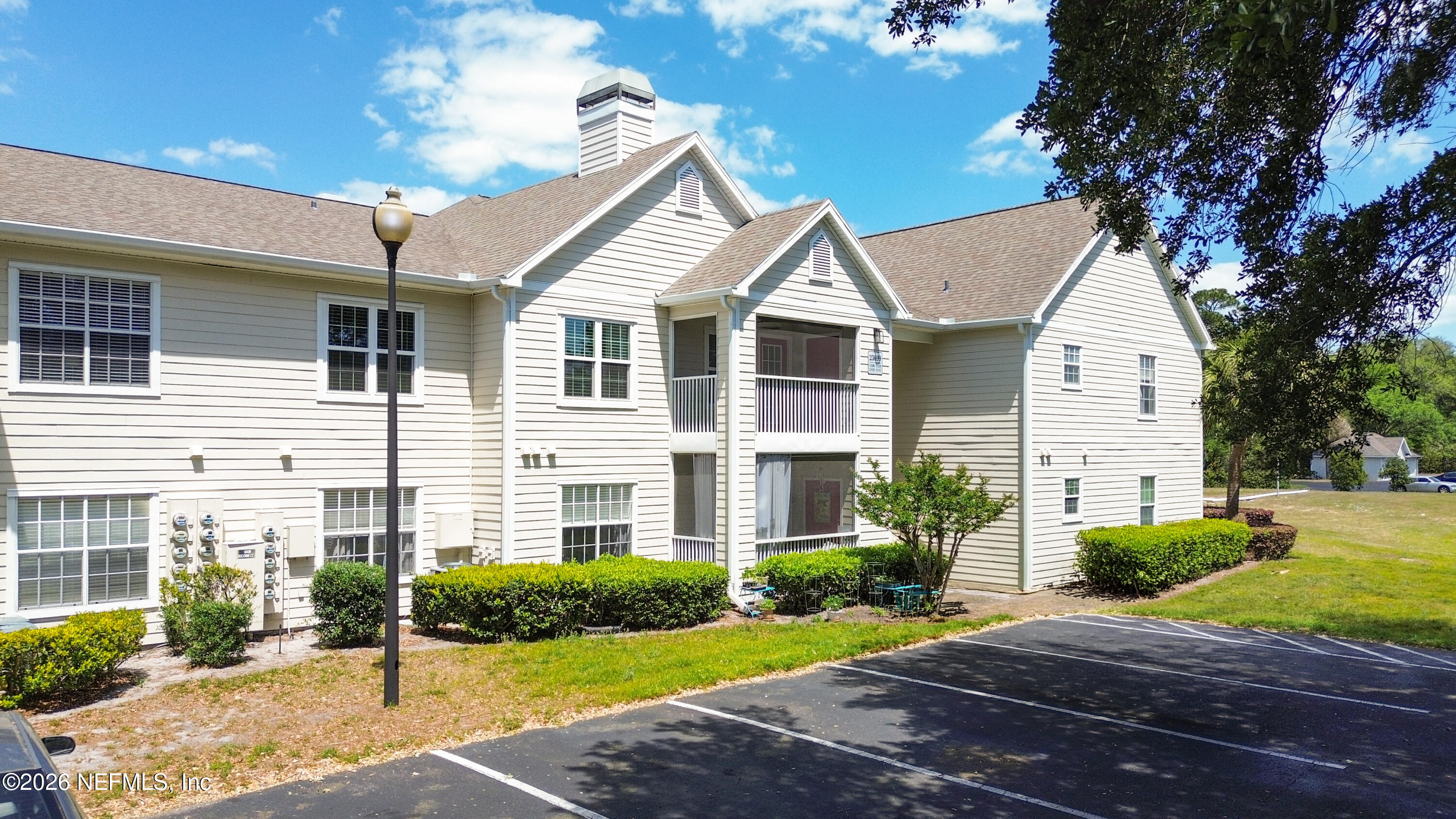 23699 Bahama Point, Unit 1126 Fernandina Beach, FL 32034 - Photo 47 of 50 a front view of a house with a yard